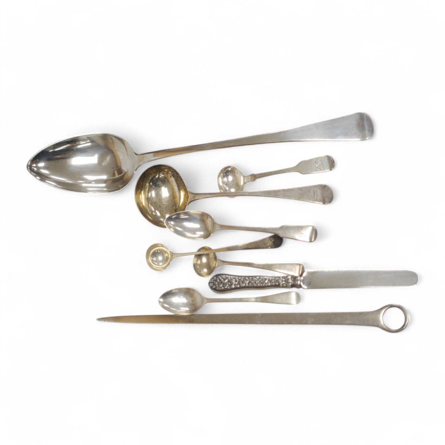 A George III silver Old English pattern basting spoon, by William Seaman, London, 1815, 31.6cm, together with a George III silver meat skewer, maker RS and six other items of silver flatware including a George III silver